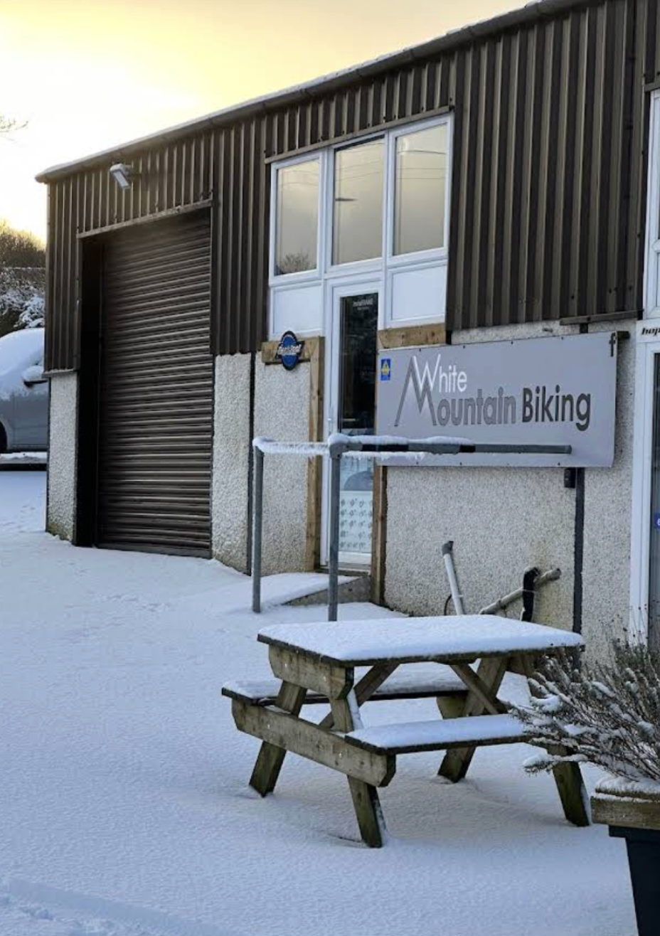White Mountain Biking shop front in the snow.